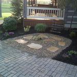 River rock and flagstone pathway gives Gallia County property another dimension to already pristine landscape.